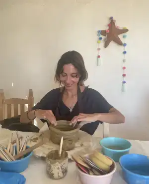 Photograph of Sophia Castro in hand-building pottery class at the Paulina Rizzo ceramics studio in Oaxaca